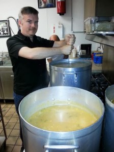 Michael Garcia keeps the soup from sticking at St. Mary's Soup Kitchen. 