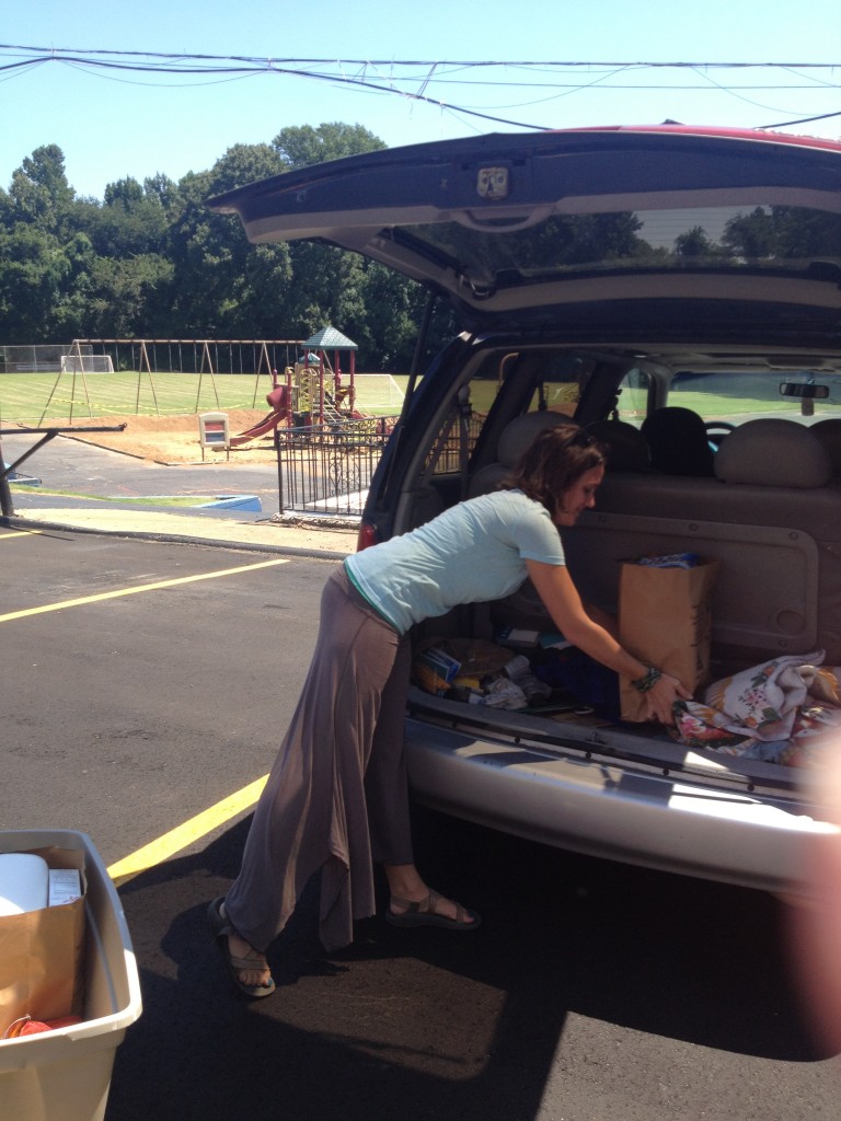 Loading groceries for a family with Catholic Charities Mobile Food Pantry
